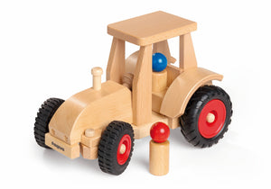 Fagus Schlepper – robuster, lenkbarer Holztraktor mit Dach und zwei Fahrerfiguren, handgefertigt in Deutschland.