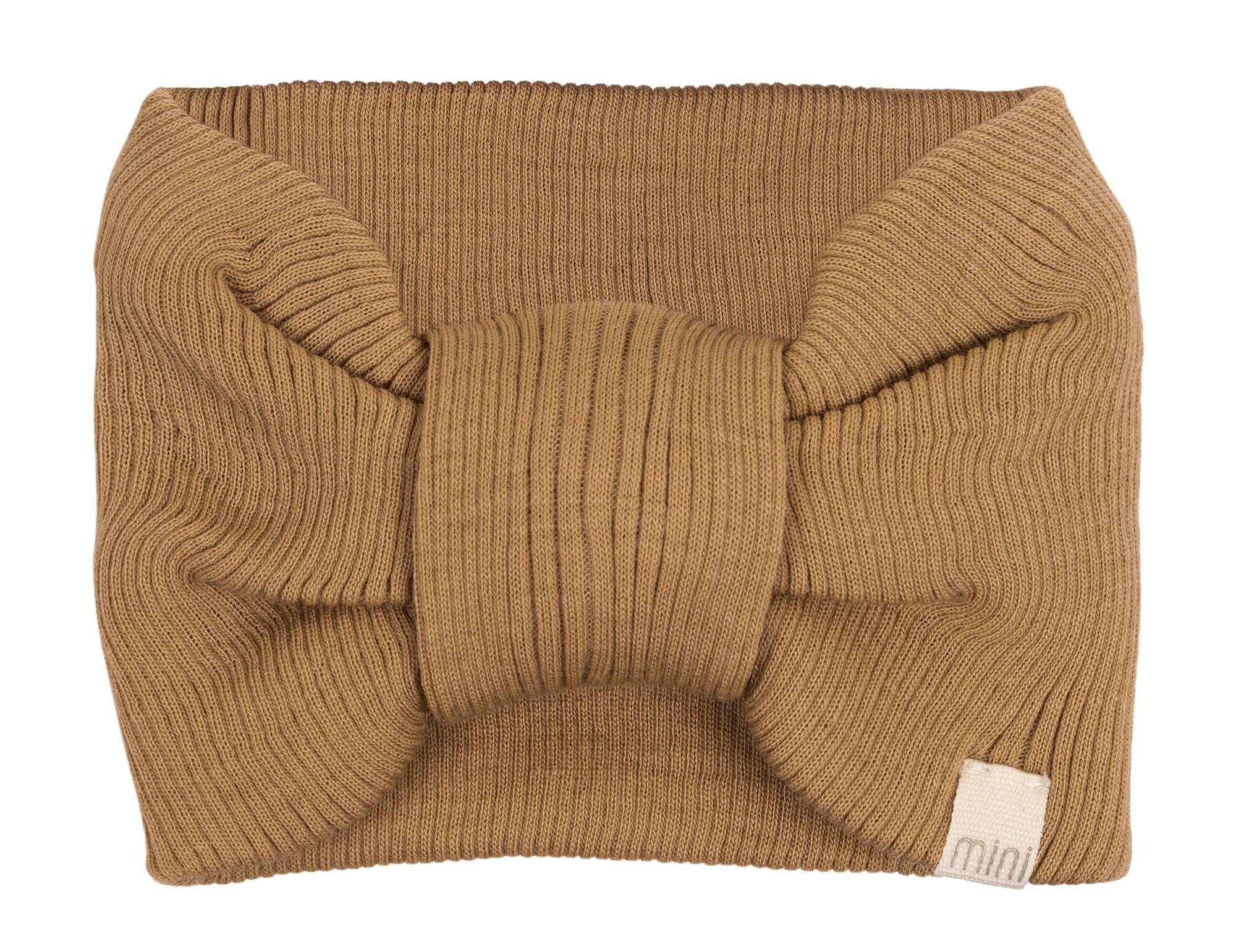 „minimalisma Stirnband ‚Alba‘ in Beige – geripptes Kinder-Stirnband aus Merinowolle, flach liegend auf hellem Hintergrund“