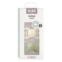 BIBS Supreme Silikon Schnuller 6–12 Monate 2er Pack Ivory/Sage – symmetrisches Saugteil mit breitem, belüftetem Schild und Glow-in-the-dark Effekt.
