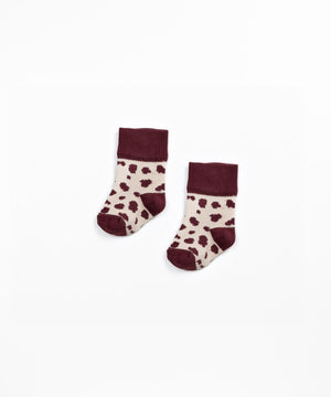 Jacquard-Socken mit Kachelmuster aus weichem Strick.