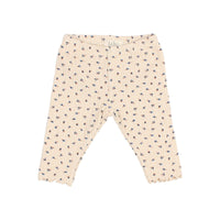 Kinderleggings von Búho in Ivory mit feiner Rippstruktur, „fall“-Print und welligem Beinabschluss mit Rüschen, elastischer Bund für bequemen Sitz.
