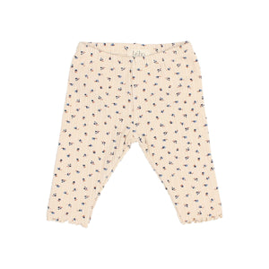 Kinderleggings von Búho in Ivory mit feiner Rippstruktur, „fall“-Print und welligem Beinabschluss mit Rüschen, elastischer Bund für bequemen Sitz.