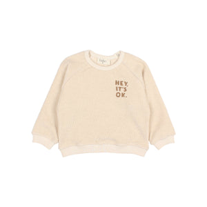 Búho Kinder-Sweatshirt in Ivory aus Frottee mit Print auf der Brust, Raglanärmeln und Druckknopfverschluss am Rücken.