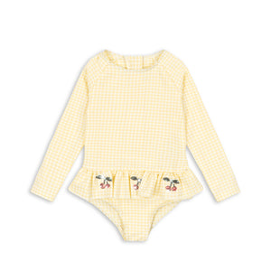 Konges Sløjd Etta Ls Swimsuit Banana Almond Check, Kinder-Langarm-Badeanzug aus Seersucker mit Rüschen und Pailletten