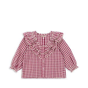 Konges Sløjd Blusenshirt „Kim Frill“ mit Rüschen und kariertem Sangria Butter Check Muster – rot-weißes Mädchenshirt aus Bio-Baumwolle
