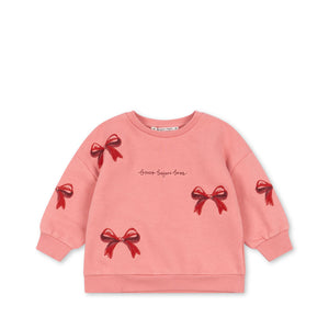 Konges Sløjd Pullover Lou Bow Strawberry Ice, rosa Kinderpullover mit Schleife im skandinavischen Design