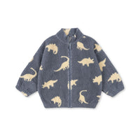 Konges Sløjd Fleecejacke „Jody“ aus Teddy-Fleece im Design Dino Mist – weiche Kinderjacke mit verspieltem Dino-Muster in sanften Naturtönen.